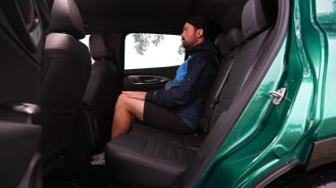 Auto Express photographer Otis Clay sitting in the Alfa Romeo Tonale&#039;s back seat