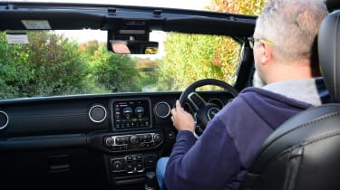 Auto Express senior test editor Dean Gibson driving a Jeep Wrangler