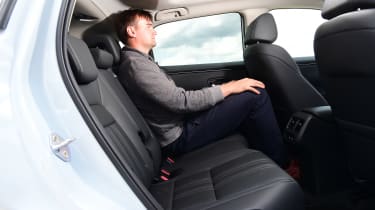 Auto Express staff writer Alastair Crooks sitting in the back of the Nissan Qashqai