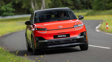 Nissan Micra EV (orange) - front cornering