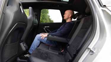 BMW iX1 - rear seats with Chief reviewer, Alex Ingram