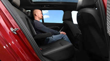 BMW i5 Touring - rear seats with Auto Express Chief reviewer, Alex Ingram