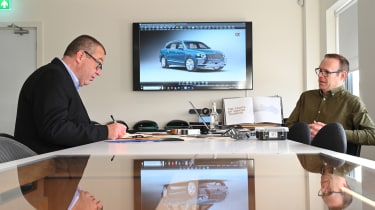 Auto Express editor-at-large John McIlroy looking at a Bentley Mulliner brochure