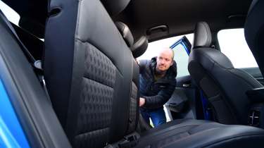 Auto Express chief reviewer Alex Ingram adjusting the MG&#039;3 rear seats
