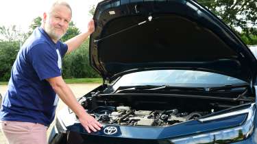 Auto Express commercial editor Paul Adam opening the Toyota C-HR&#039;s bonnet