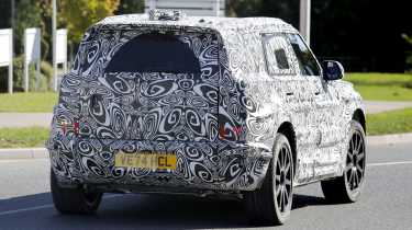 New Land Rover Defender Sport spy shot - rear tracking 