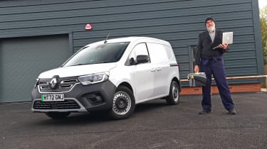 Auto Express senior road test editor Dean Gibson standing next to the Renault Kangoo in full work gear