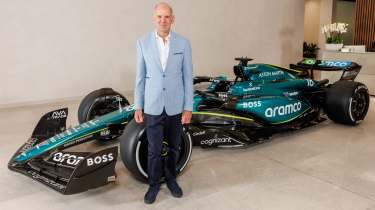 Adrian Newey standing in front of an Aston Martin F1 car