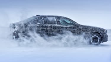 Camouflaged BMW i5 winter testing (official picture) - side drifting