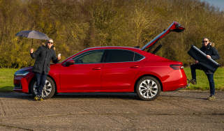 Auto Express senior photographer Pete Gibson standing by the Skoda Superb