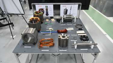 Selection of EV motor components displayed on a table