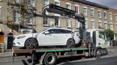 Foreign car clampdown - on truck
