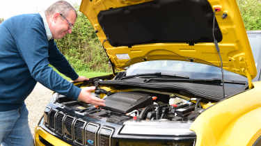 Auto Express editor-at-large John McIlroy inspecting the Jeep Avenger&#039;s engine bay