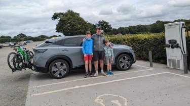 Auto Express head of digital content Steve Walker standing with his sons next to the Nissan Ariya