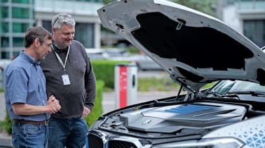 Auto Express consumer and current affairs editor Chris Rosamond inspecting a hydrogen-powered BMW