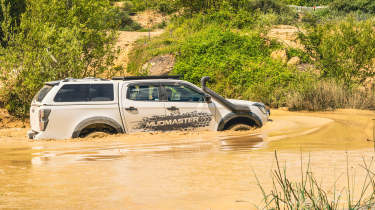 Isuzu D-Max Mudmaster - driving through muddy water (side)