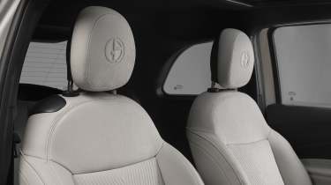 Fiat 500e Giorgio Armani - front seats with Armani logo embossed into headrest 