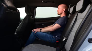 Auto Express chief reviewer Alex Ingram sitting in the back of the Renault Megane E-Tech