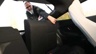 Auto Express senior test editor Dean Gibson folding the Honda Prelude's rear seats