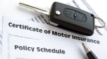 Car insurance documents and car key