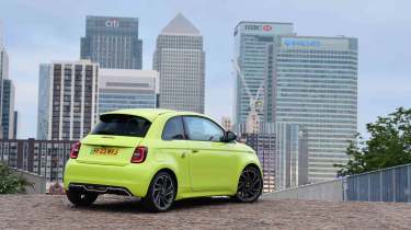 Abarth 500e - rear static, city background