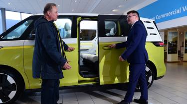 Auto Express editor-in-chief Steve Fowler being shown the Volkswagen ID. Buzz&#039;s sliding door by Volkswagen sales executive Tom Lodge 
