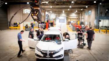 Honda Civic being prepared for crash testing