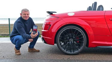 Auto Express contributing editor Steve Sutcliffe potining at the Audi TT Roadster Final Edition&#039;s rear bumper