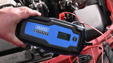 Auto Express Product Awards 2026 - products editor Tom Barnard using the Draper 12V battery charger