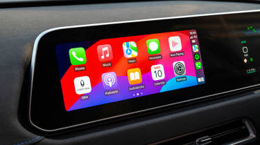 Infotainment system displaying Apple CarPlay menu