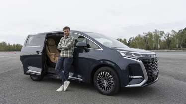 New Denza D9 - Auto Express senior news reporter Alastair Crooks stood next to the Denza D9, front static