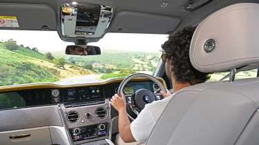 Auto Express senior staff writer Jordan Katsianis driving the Rolls-Royce Cullinan Series II