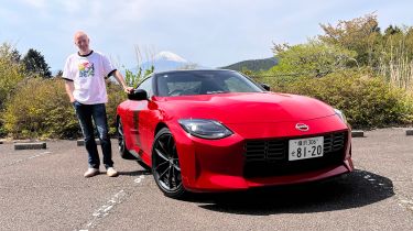 Auto Express editor-at-large Phil McNamara standing next to a Nissan Z