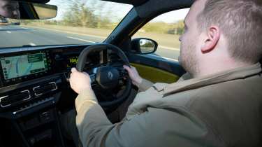 Auto Express news reporter Ellis Hyde driving the Renault 5