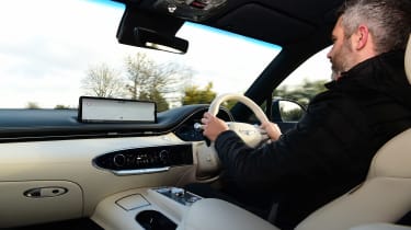 Richard Ingram driving the Genesis Electrified GV70