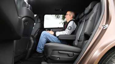 Auto Express senior test editor Dean Gibson sitting in the Hyundai Santa Fe&#039;s middle row seats