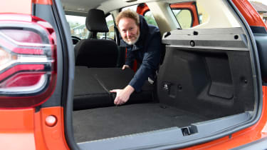 Auto Express web producer Pete Baiden folding the Dacia Duster&#039;s rear seats