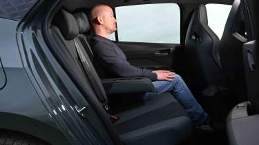 Cupra Born - rear seats with Chief reviewer, Alex Ingram