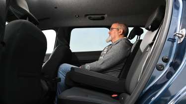 Dacia Bigster - rear seats being sat in by Auto Express senior reviewer Dean Gibson 