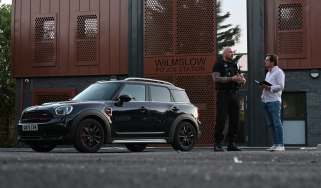 Auto Express consumer reporter Tom Jervis talking to PC Mark Jones outside Wilmslow police station