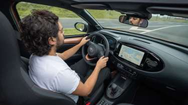 Jordan Katsianis driving the Toyota Aygo X Hybrid
