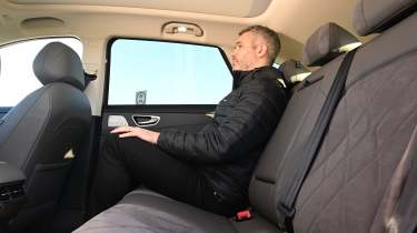 Auto Express deputy editor Richard Ingram sitting in the MGS6 EV Trophy Long Range&#039;s back seat