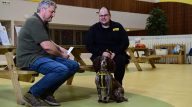 Auto Express current affairs and features editor Chris Rosamond talking with a Dogs Trust volunteer