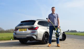 BMW 300e Touring long term test - Richard Ingram with charging cable