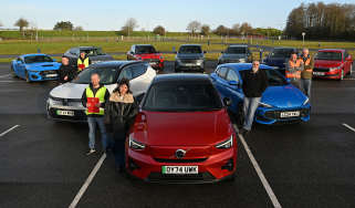 Auto Express team members standing with a selection of cars