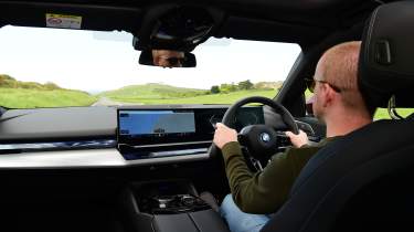 Auto Express chief reviewer Alex Ingram driving the BMW 530e