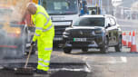 Pothole repair taking place with Citroen in the background