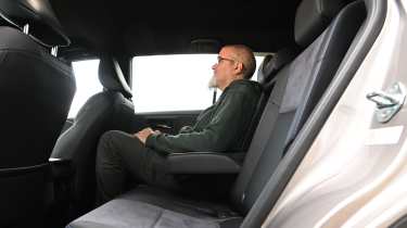 Auto Express senior road test editor Dean Gibson sitting in the Toyota RAV4's rear seat