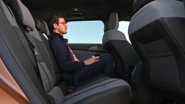 Tom Jervis sitting in the Vauxhall Grandland Electric GS