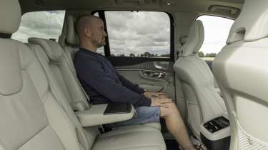 Volvo XC90 - rear seats being sat in by Auto Express chief reviewer Alex Ingram 